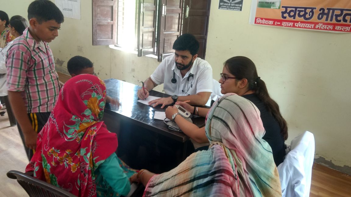 Doctor meeting a family at a health camp